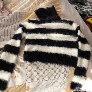 Cropped soft turtleneck sweater from Bebe